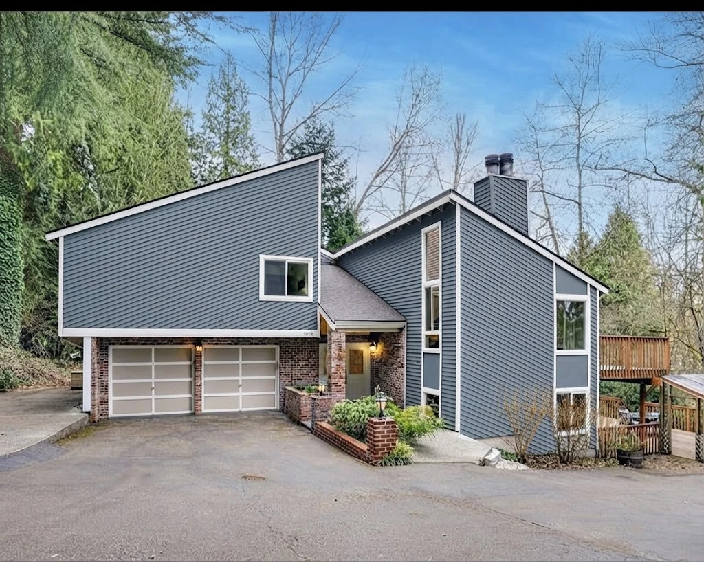 AI paint concept showing the same house with muted slate-blue siding and soft white trim