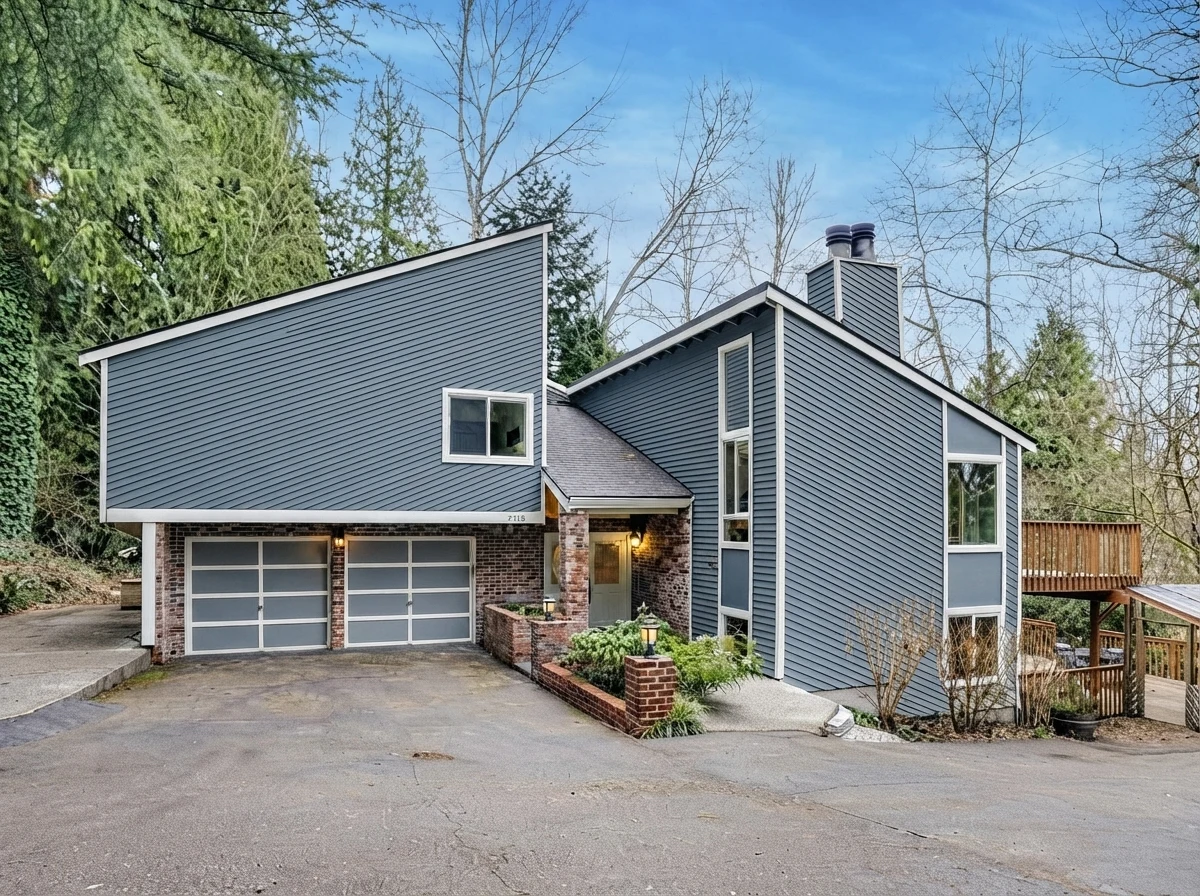 AI exterior paint concept of the attributed house photo with slate-blue siding and warm-white trim