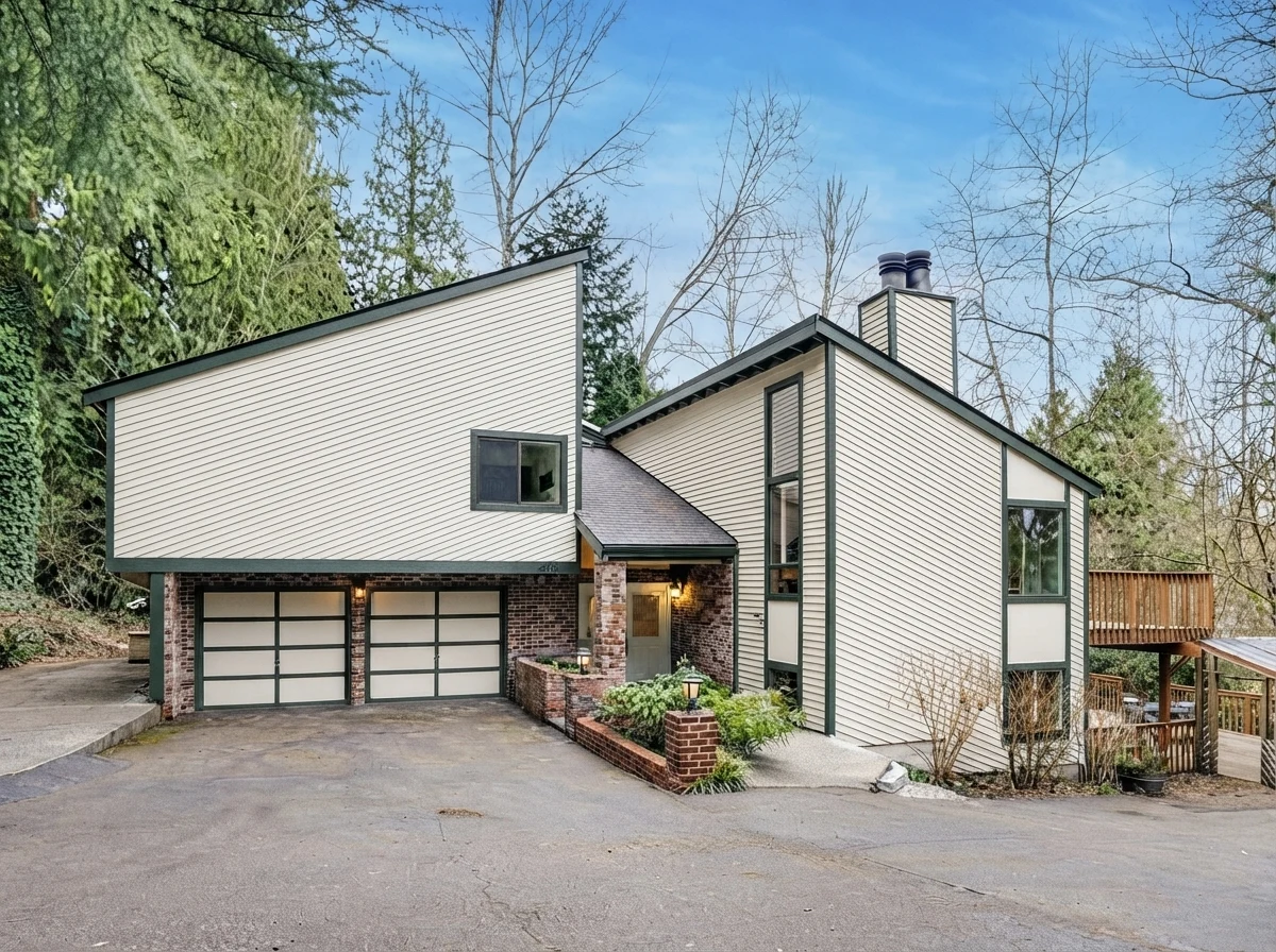 AI exterior paint concept of the attributed house photo with warm-white siding and charcoal-green trim