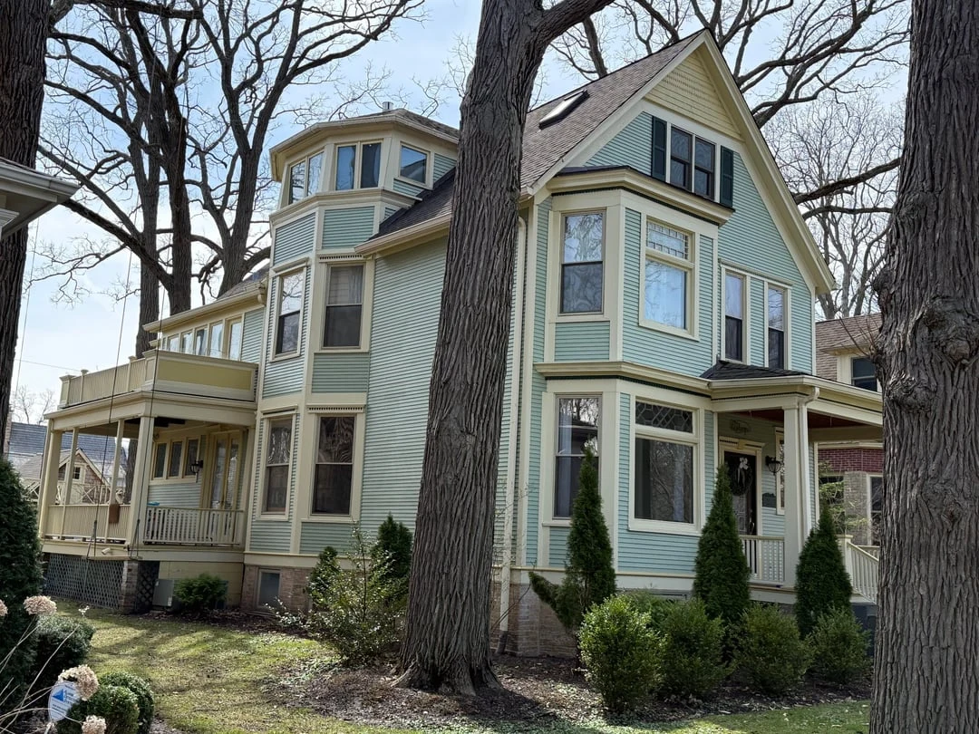 Public Reddit source photo of a pale-green Victorian house with cream trim and dark shutters