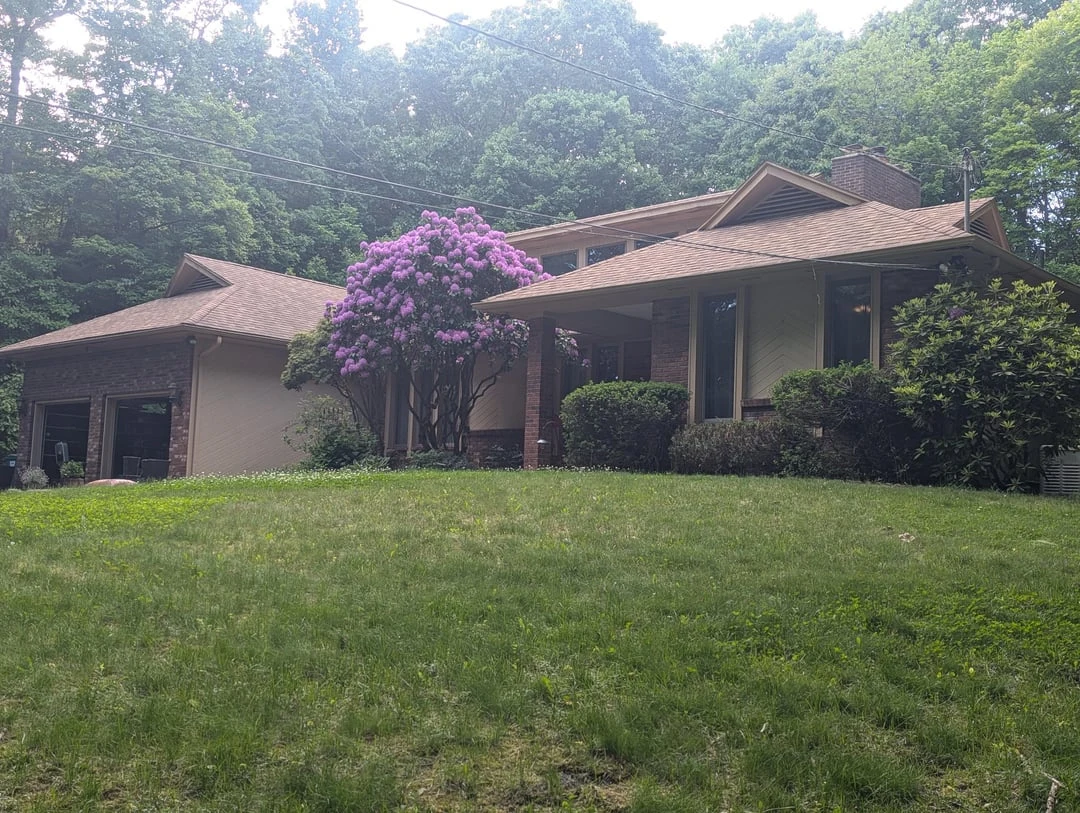 Public Reddit source photo of a house submitted for exterior and trim color suggestions around a warm roof
