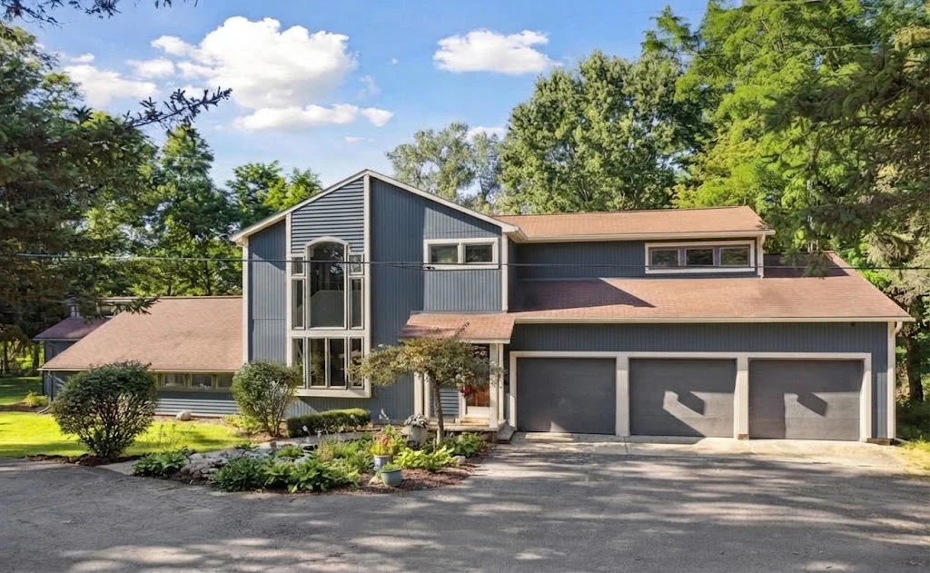 AI paint concept of the attributed whole-house source photo with muted blue-gray siding and warm-white trim